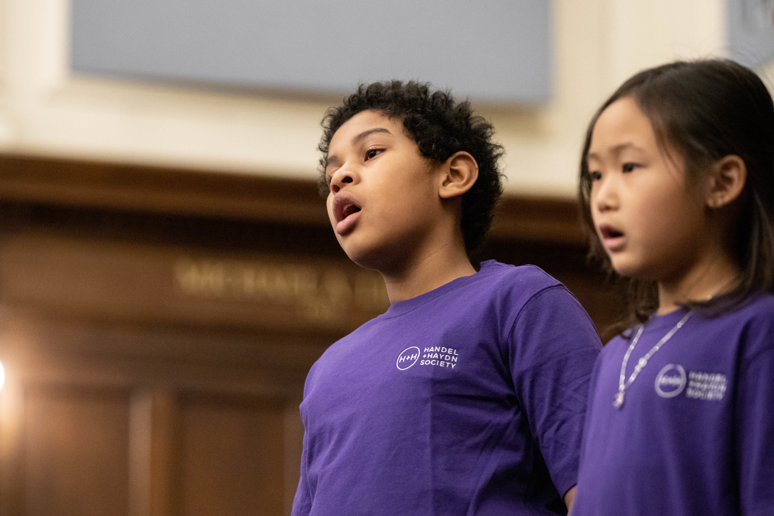 A young male and female student singing