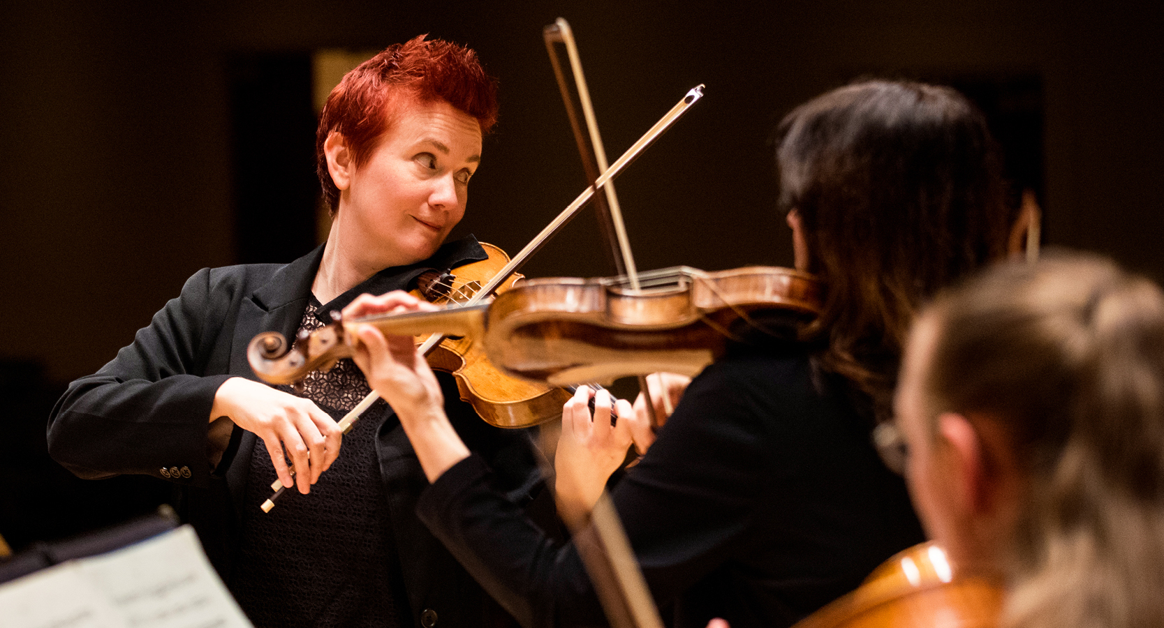 Concertmaster Aisslinn Nosky playing