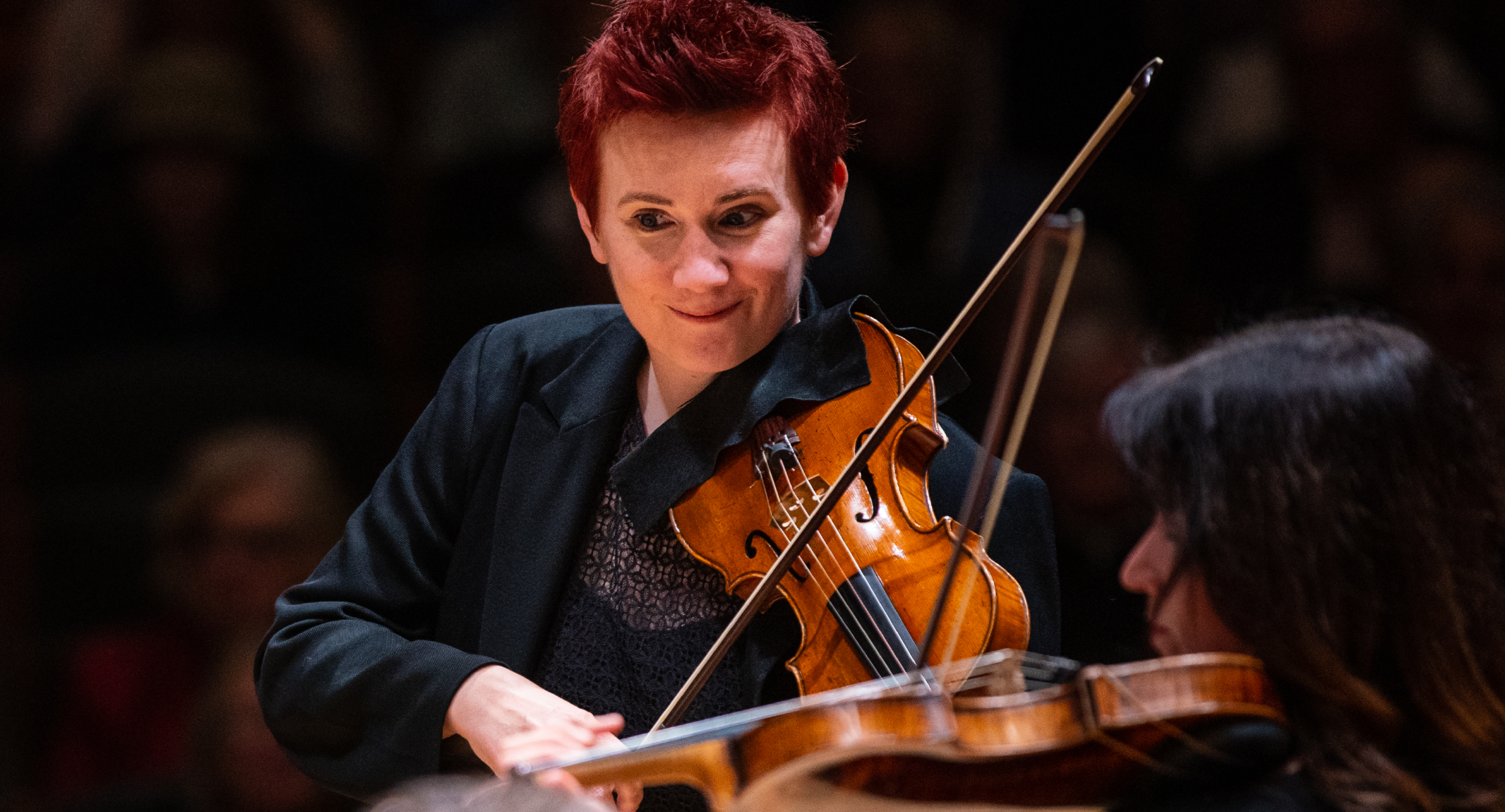 Concertmaster Aisslinn Nosky playing