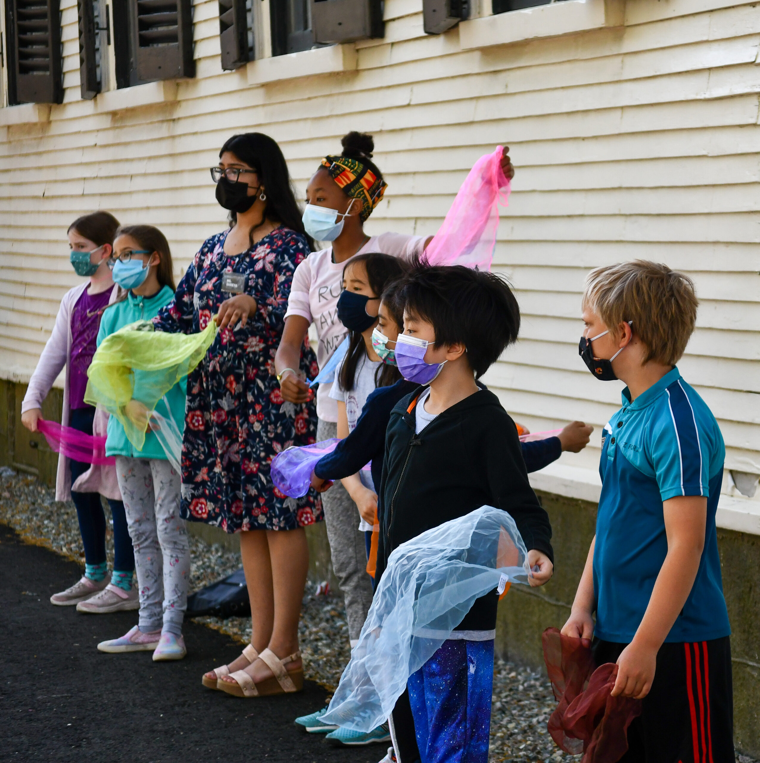 group of kids wearing masks