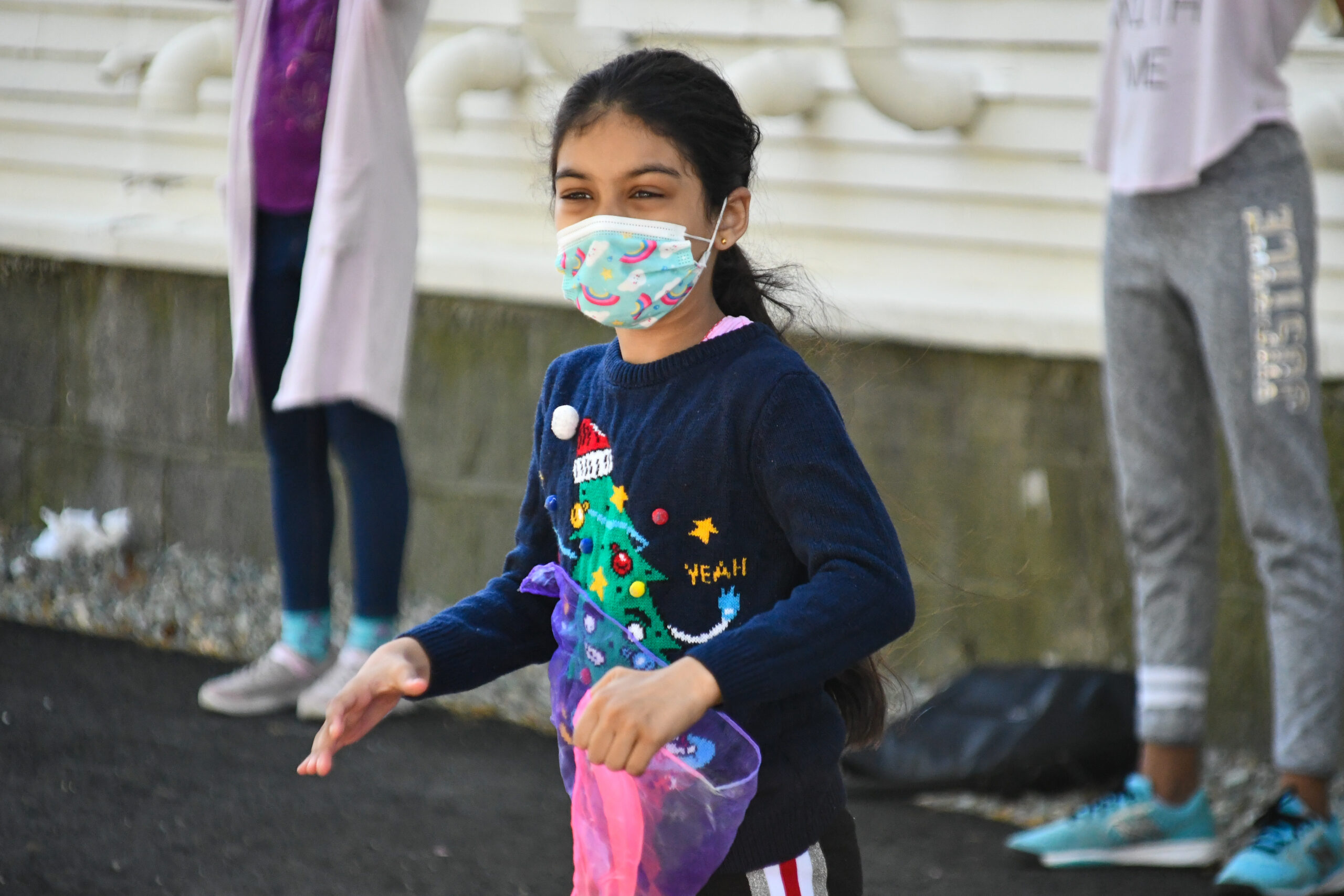 little girl wearing a mask